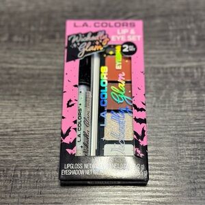 L.A. Colors lip & eyeshadow set with shimmery lipgloss & glitter gold eyeshadow.